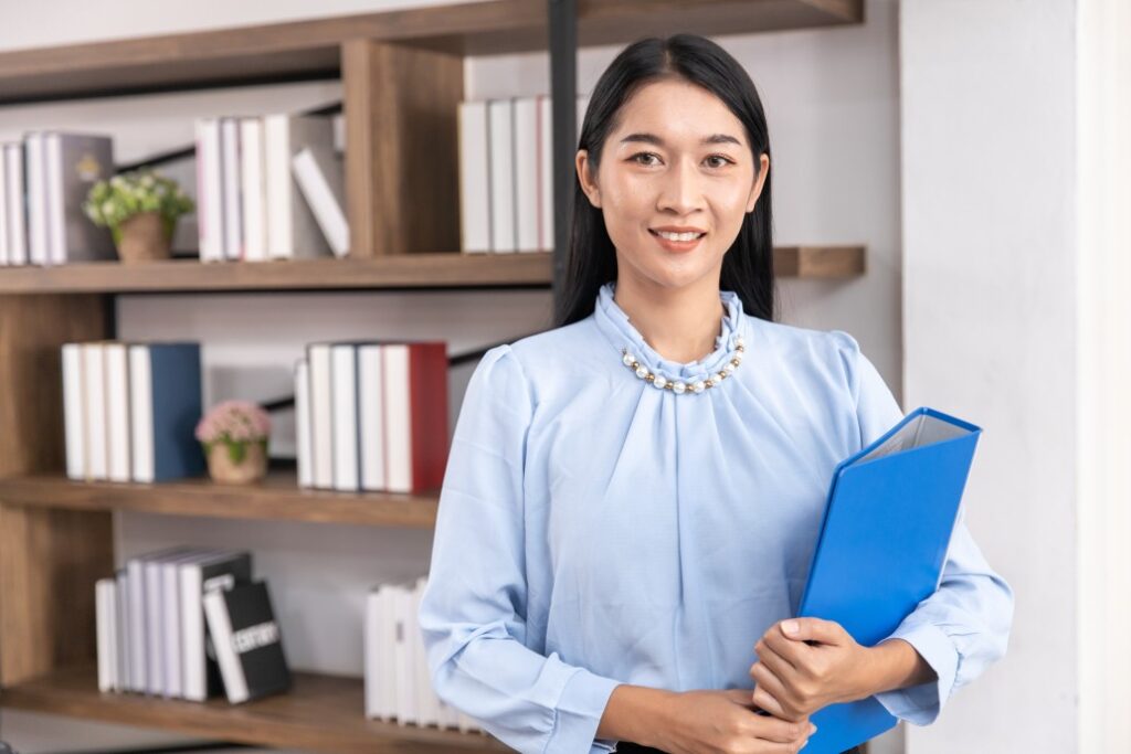 A Female Holding Document Working Entry-Level Jobs In Finance Industry